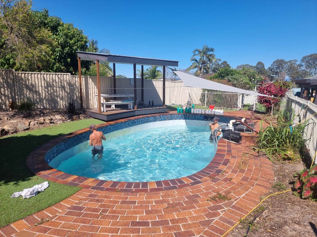 Acid wash treatment being applied to pool