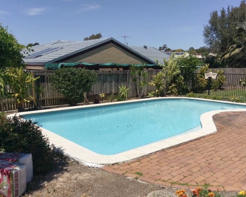 Pool after chemical treatment — crystal clear blue water