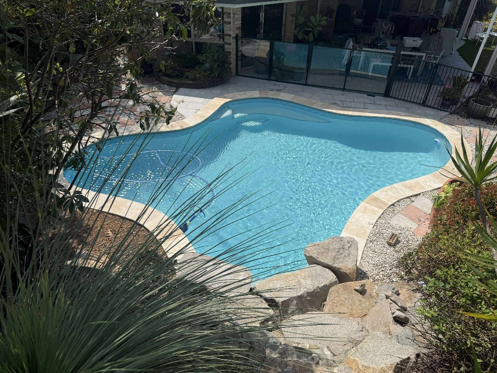 Freeform pool after treatment — crystal clear from above