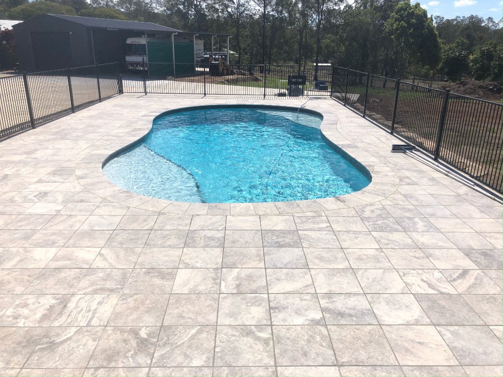 Pool after full renovation — new paving and crystal water